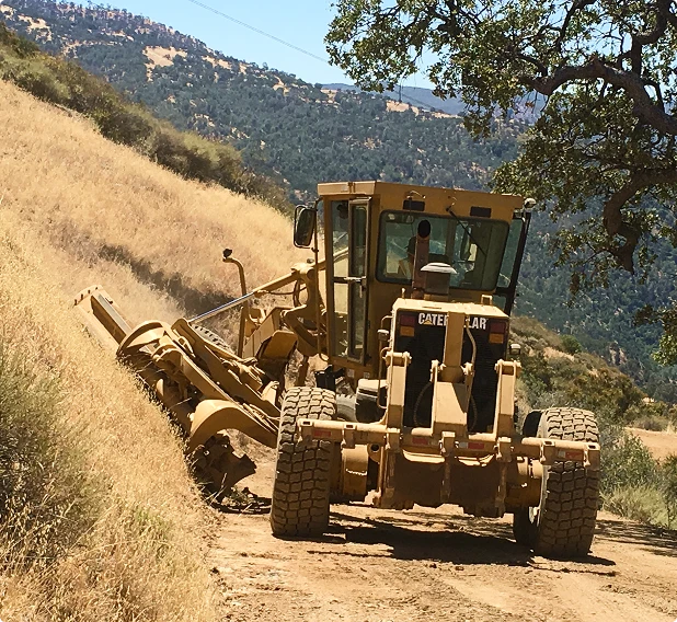 road_grader_hillside bucket-truck-mountain